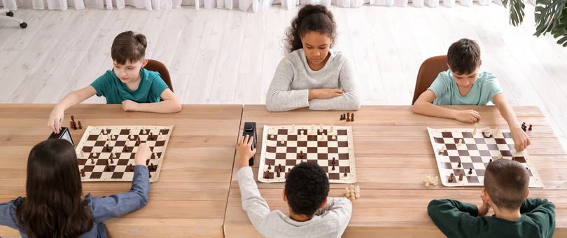 Kids playing in a chess tournament