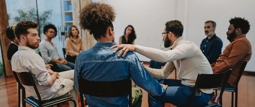 people in a circle at a support group